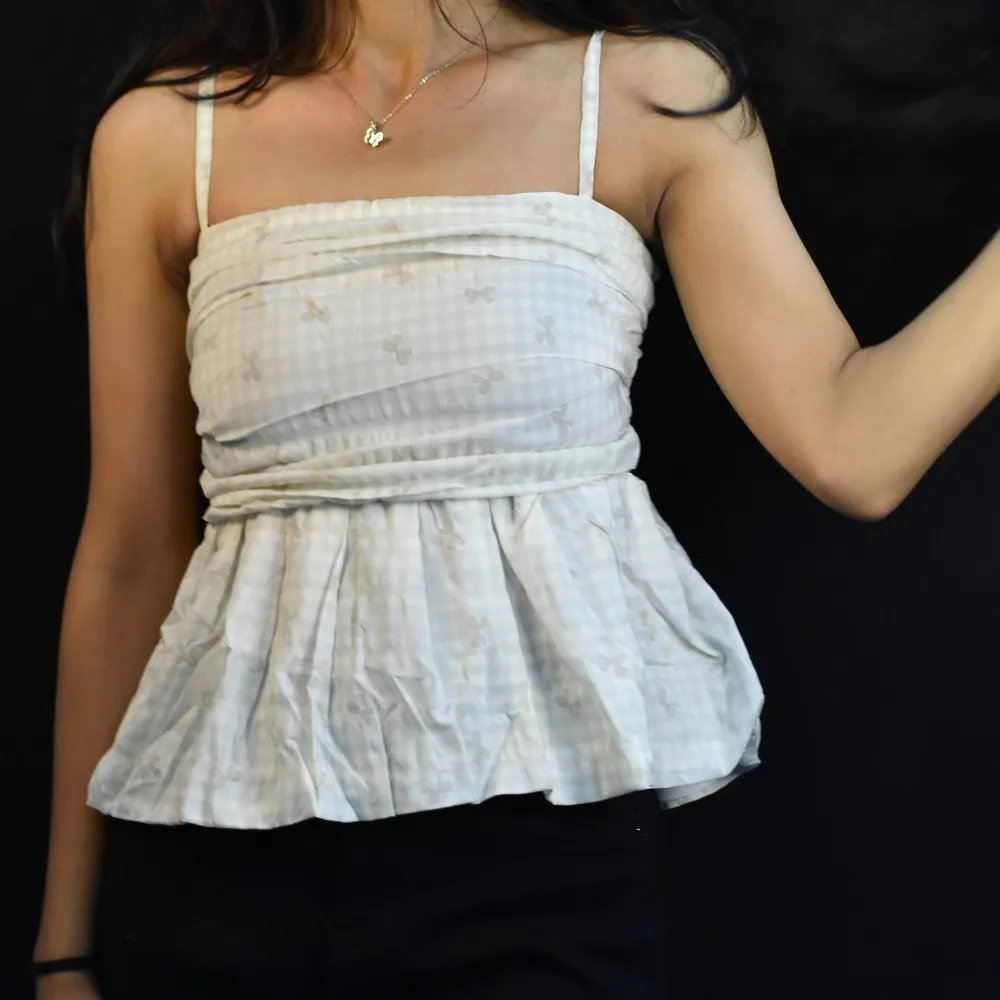 Ivory NYVAZ Women's Ivory Bow Embroidered Peplum Cami Top